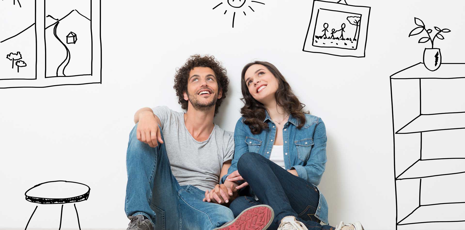 young couple on floor with dreamy looks and sketched furniture around them.